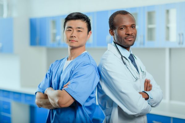 portrait of multiracial group of doctors in medical uniforms in clinic portrait of multiracial group of doctors in medical uniforms in clinic